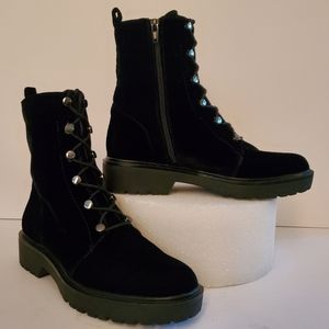 Black velvet combat boots.
